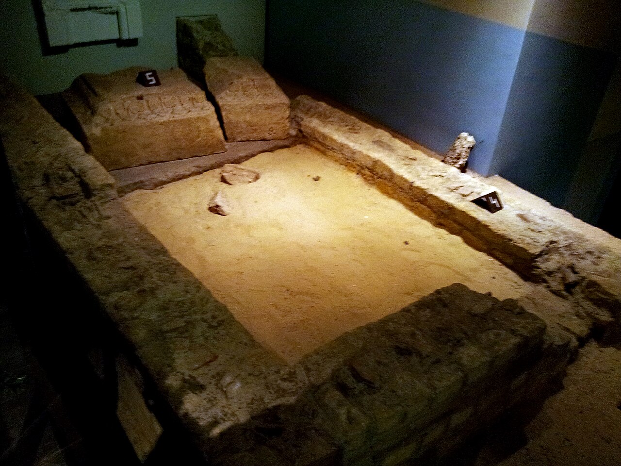 Excavated remains of the Roman sanctuary in the Derlon museum cellar.
